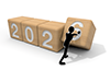 This illustration shows a person completing the numbers for 2026. The person is lining up wooden blocks and pressing the final 