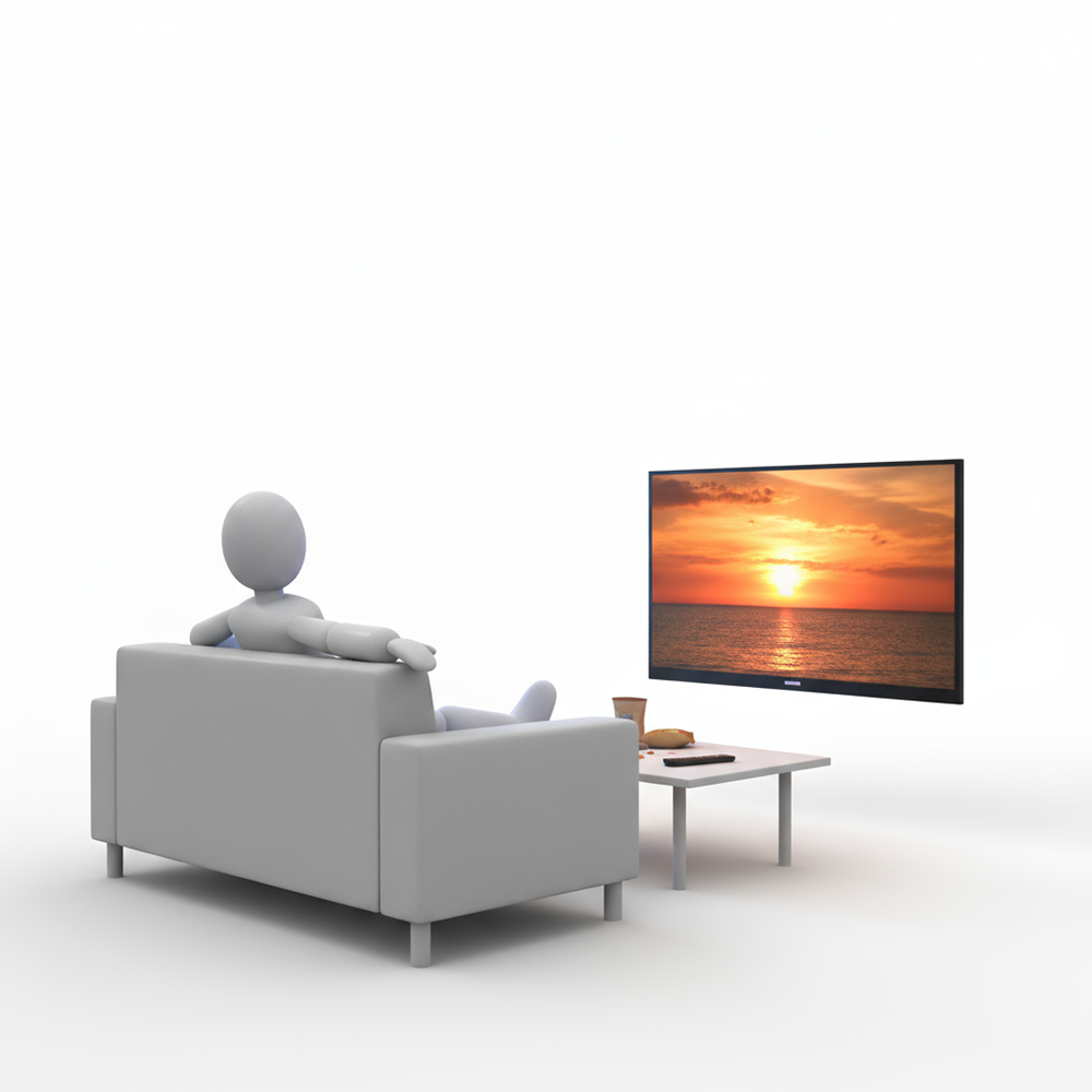 A person sitting on a sofa watching a sunset on TV